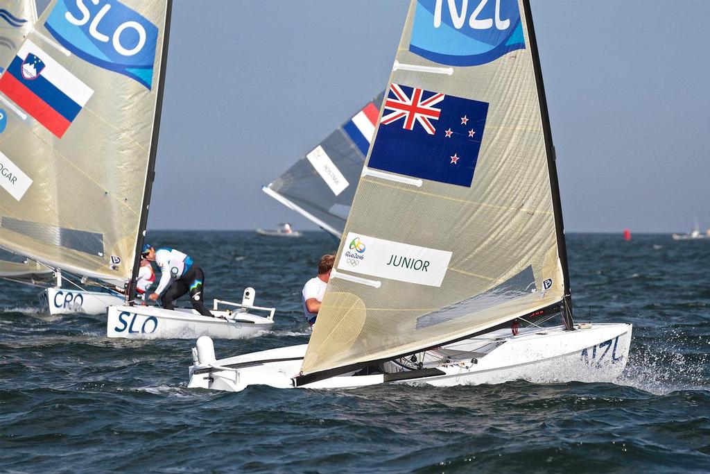 Josh Junior (NZL) leaves the leeward mark in the Finn class Medal Race © Richard Gladwell www.photosport.co.nz